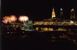 Cleveland, Ohio's skyline at night during bicentennial with fireworks in the flats