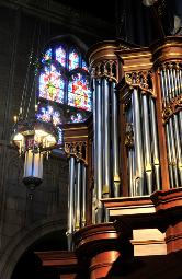 photograph of the stained glass window, chandalier and large pipe organ (all in one photo) from inside Trinity Cathedral, Cleveland, Ohio