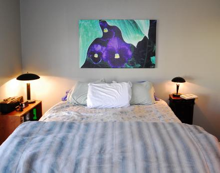 Kurt Shaffer Photographs Peeking Pansies on Canvas in bedroom