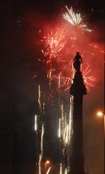 The Soldier's and Sailor's Monument on Cleveland, Ohio's Pulblic Square with fireworks behnid it